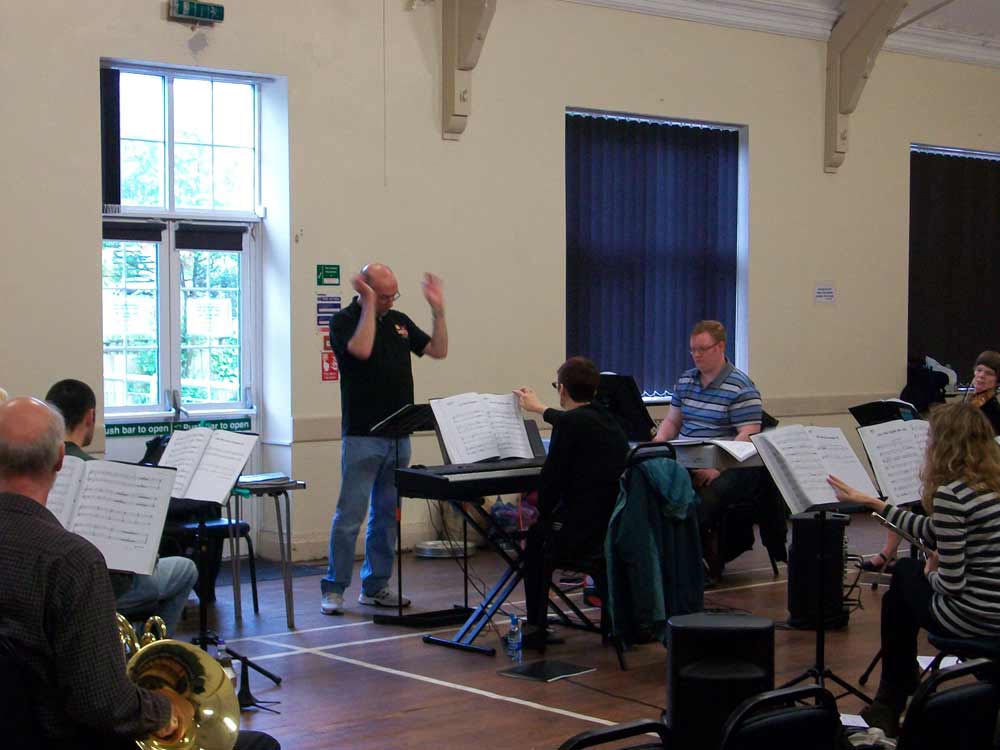 Rob Bowness leads the orchestra, Jonny Clayton, Imogen Hayward on keyboards